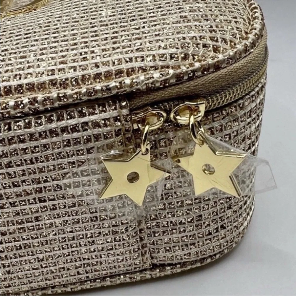 Dior 2025 Limited Holiday Edition cosmetic pouch in a gold, sparkly material.